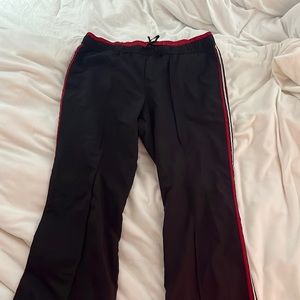 Red black and white track pants size M